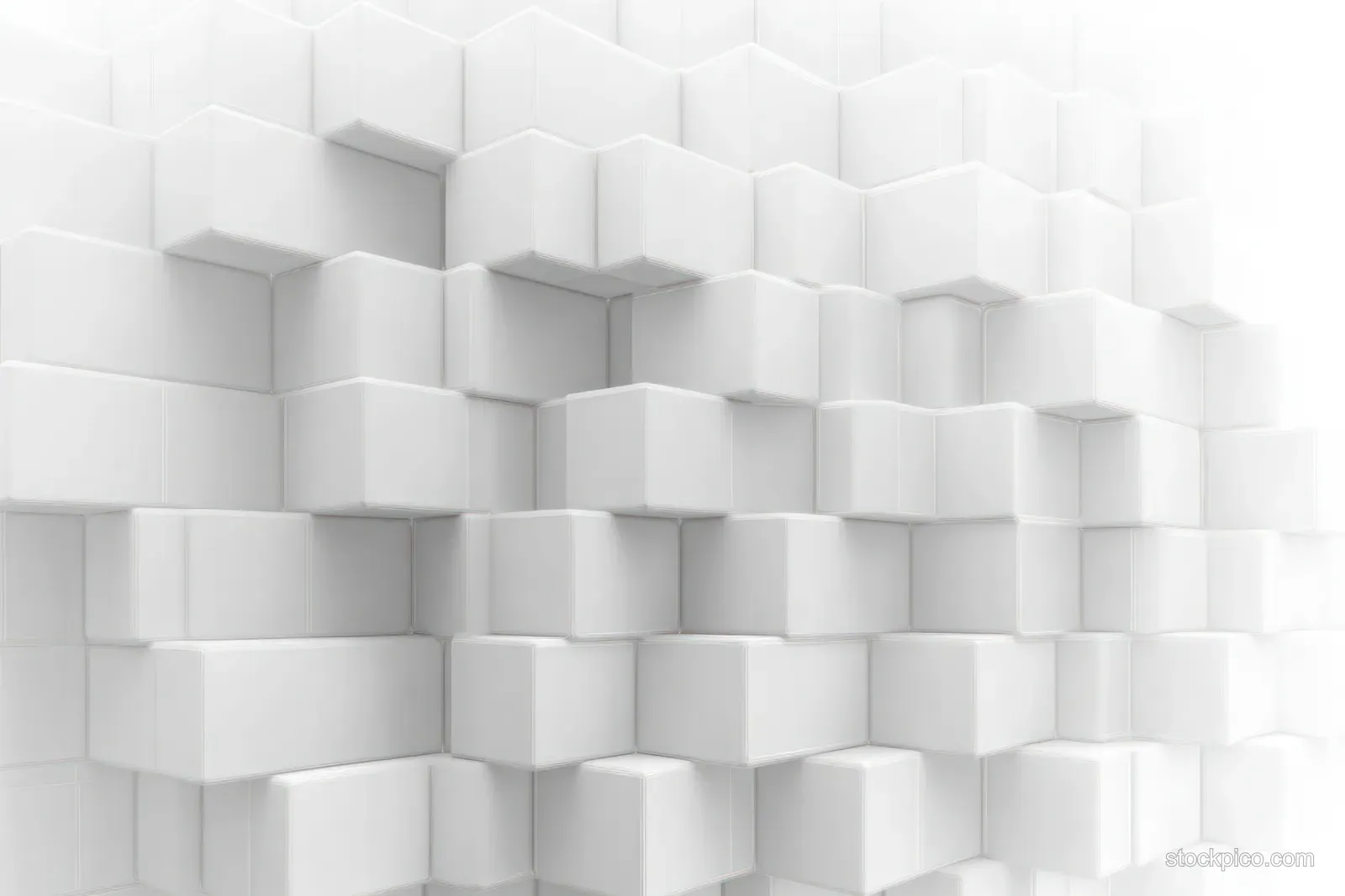 Staggered white cubes interlock on a textured wall, forming a geometric 3D pattern with visible depth.