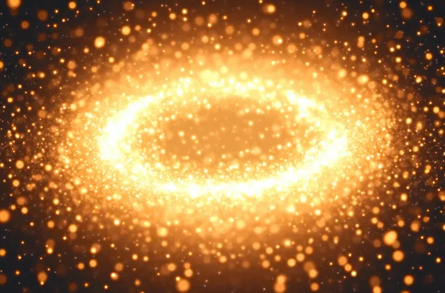 A glowing golden particle halo ring shimmers in dark space, forming a luminous circular orbit of stardust.