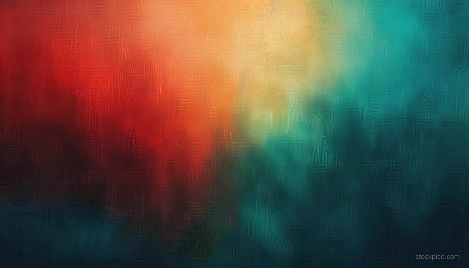 Blurred abstract texture where warm orange and red blend into cool green and blue hues.