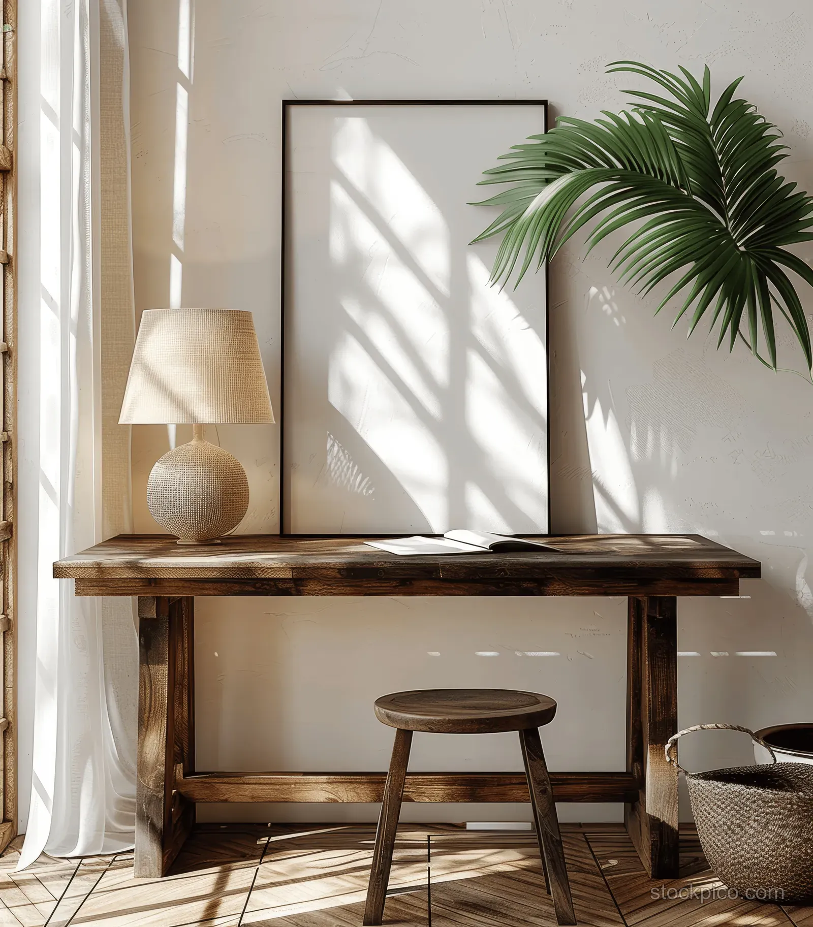 Rustic wooden desk in a sunlit minimalist living room with a tropical plant and a poster frame mockup.