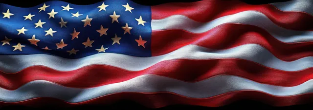 American flag fills the frame as stars and red-white stripes wave with textured fabric in dramatic light.