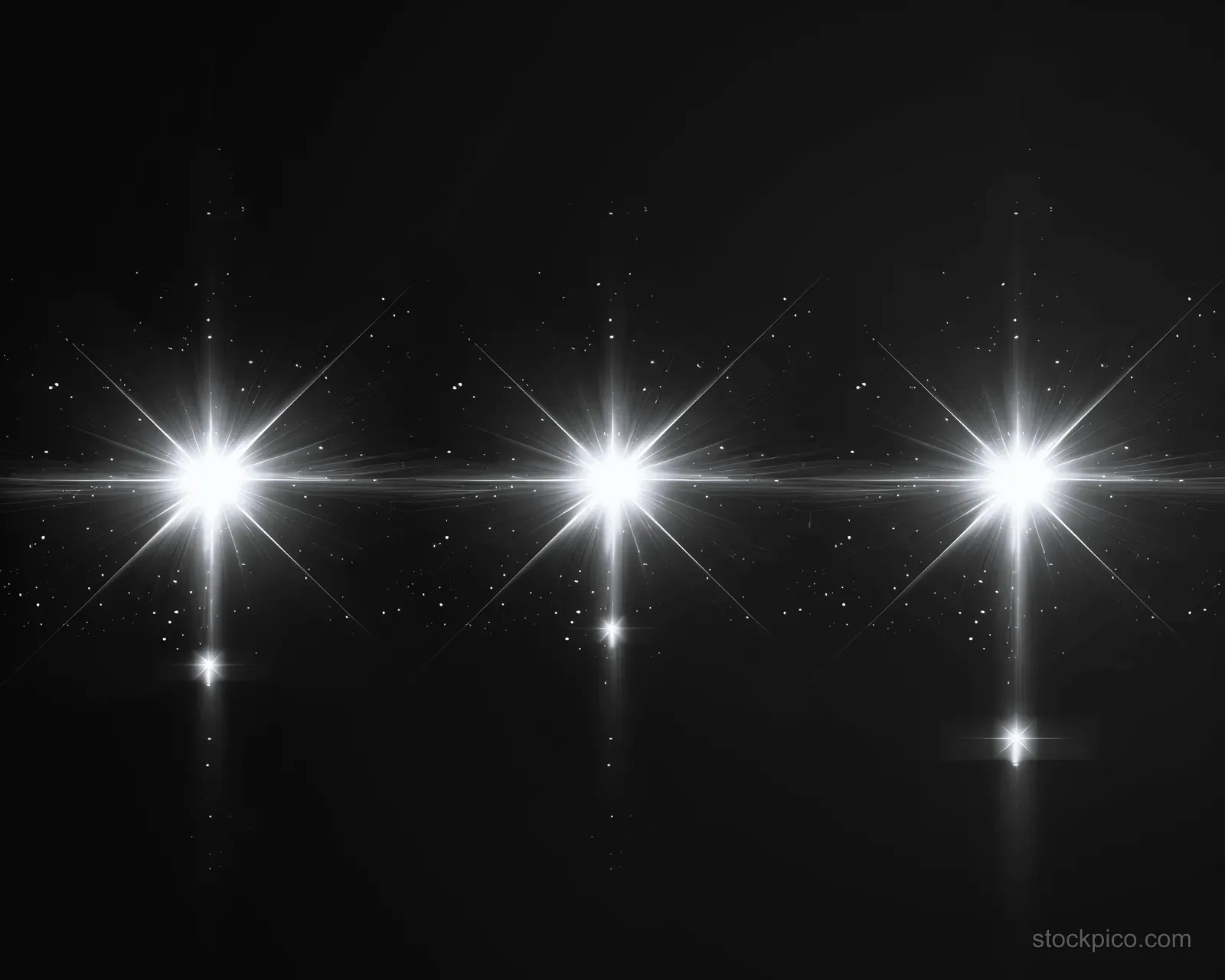 Three bright white lens flare points emit sparkling light rays across a black background.