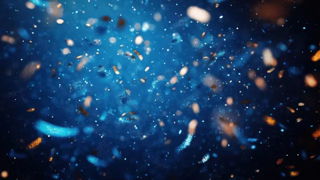 Glowing dust particles drift through deep blue space with soft bokeh sparkles and cosmic haze.