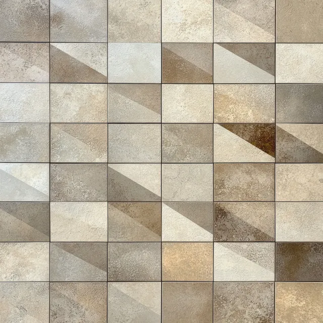 Close view of a beige and brown square tile wall showing a textured geometric pattern with depth shadows.