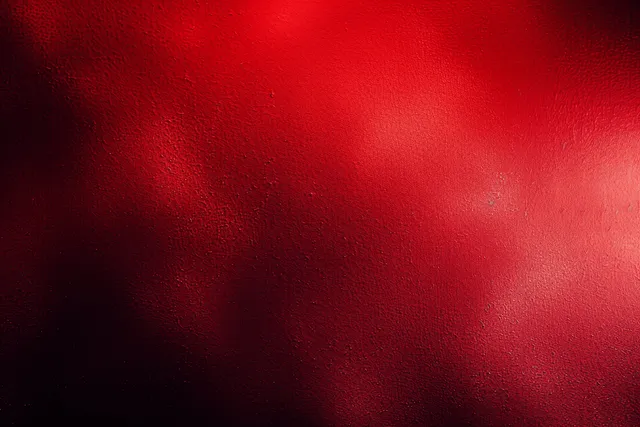 Dark red and black gradient background with rough grain, faint glitter specks, and glowing wavy streaks.