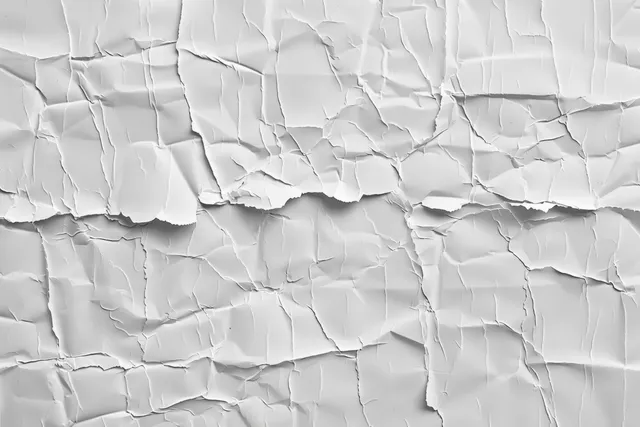 Torn white paper texture with wet paste wrinkles on urban poster background