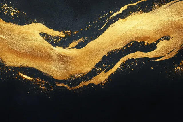 Golden ink wave with splatter and textured brush grit across a dark black background.
