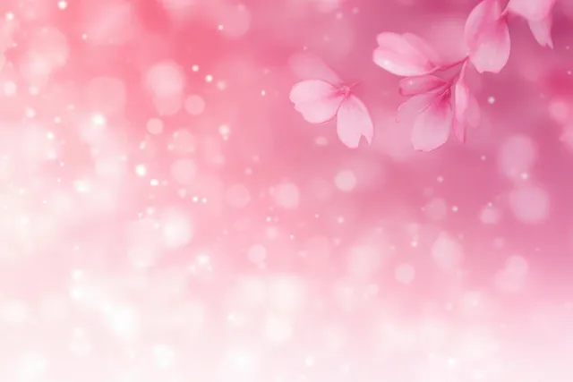 Soft pink petals drifting before a dreamy bokeh spring background