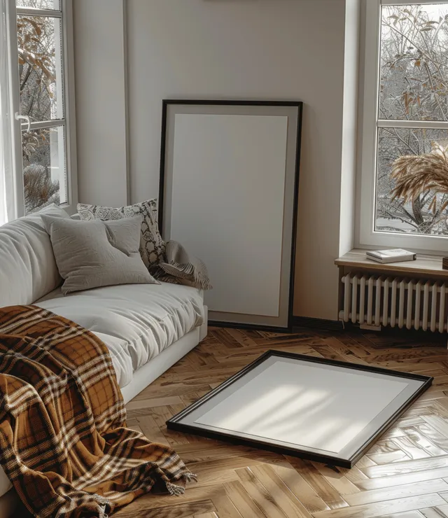 Cozy minimalist living room scene with wooden parquet floor and white poster frame on checkered blanket