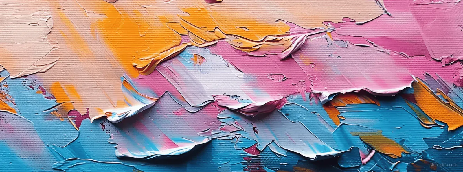 Closeup of layered abstract oil paint brushstrokes on a colorful canvas with visible texture.