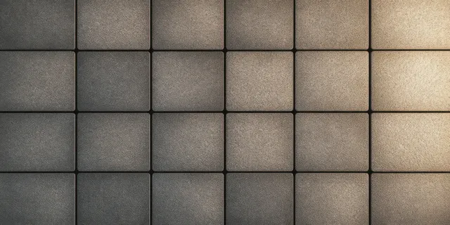 Close-up textured square tile pattern with soft diffused light and subtle shadows