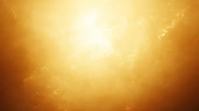 Golden sunlight beams shine through a textured surface, creating a warm glowing haze.