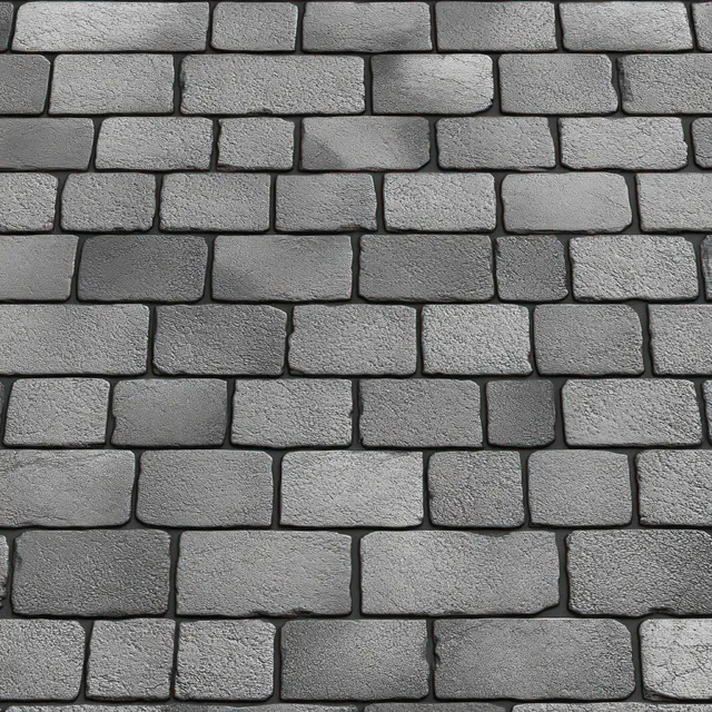 Close-up of a grey stone brick wall with rectangular blocks and visible mortar lines between them.