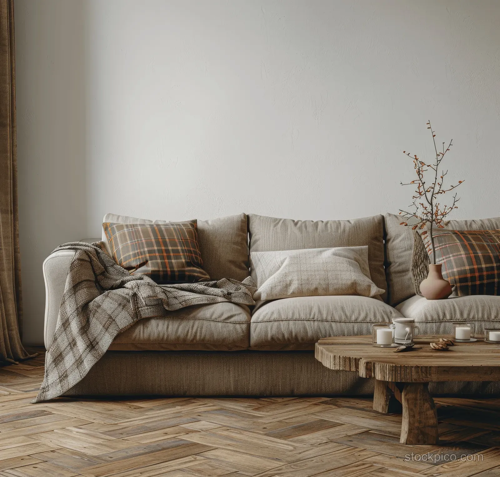 Beige plaid sofa and wooden coffee table on warm parquet floor in a minimalist living room interior.