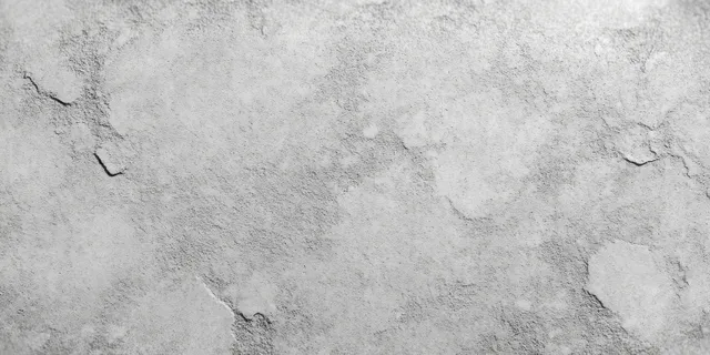 Close-up of a rough gray concrete wall with visible cracks and weathered patched areas.