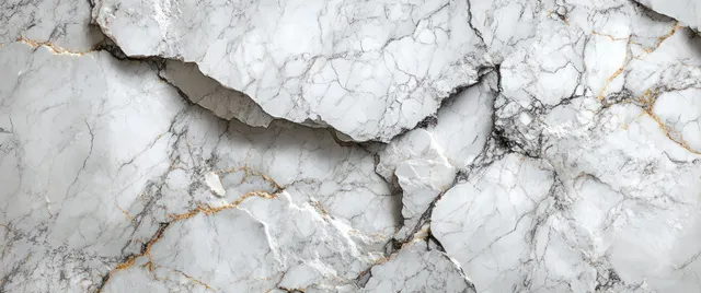 White Carrara marble slab with soft gray veining and cracked natural texture