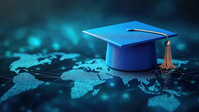 Blue graduation cap with gold tassel placed on a glowing digital world map background.