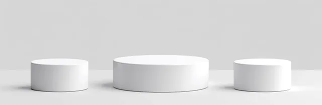 Three white cylindrical podiums sit on a gray background with soft shadows.