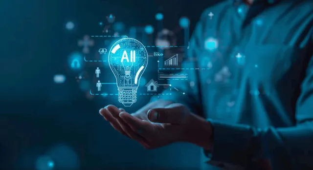 Businessman presents a glowing AI lightbulb icon over dark tech screens