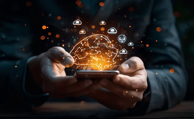 Hands holding smartphones displaying glowing AI chat bubbles and circuit network interface