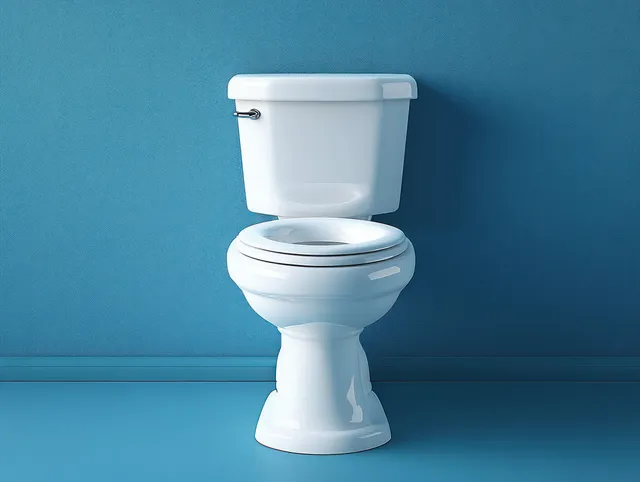 White ceramic toilet with closed lid against solid blue wall