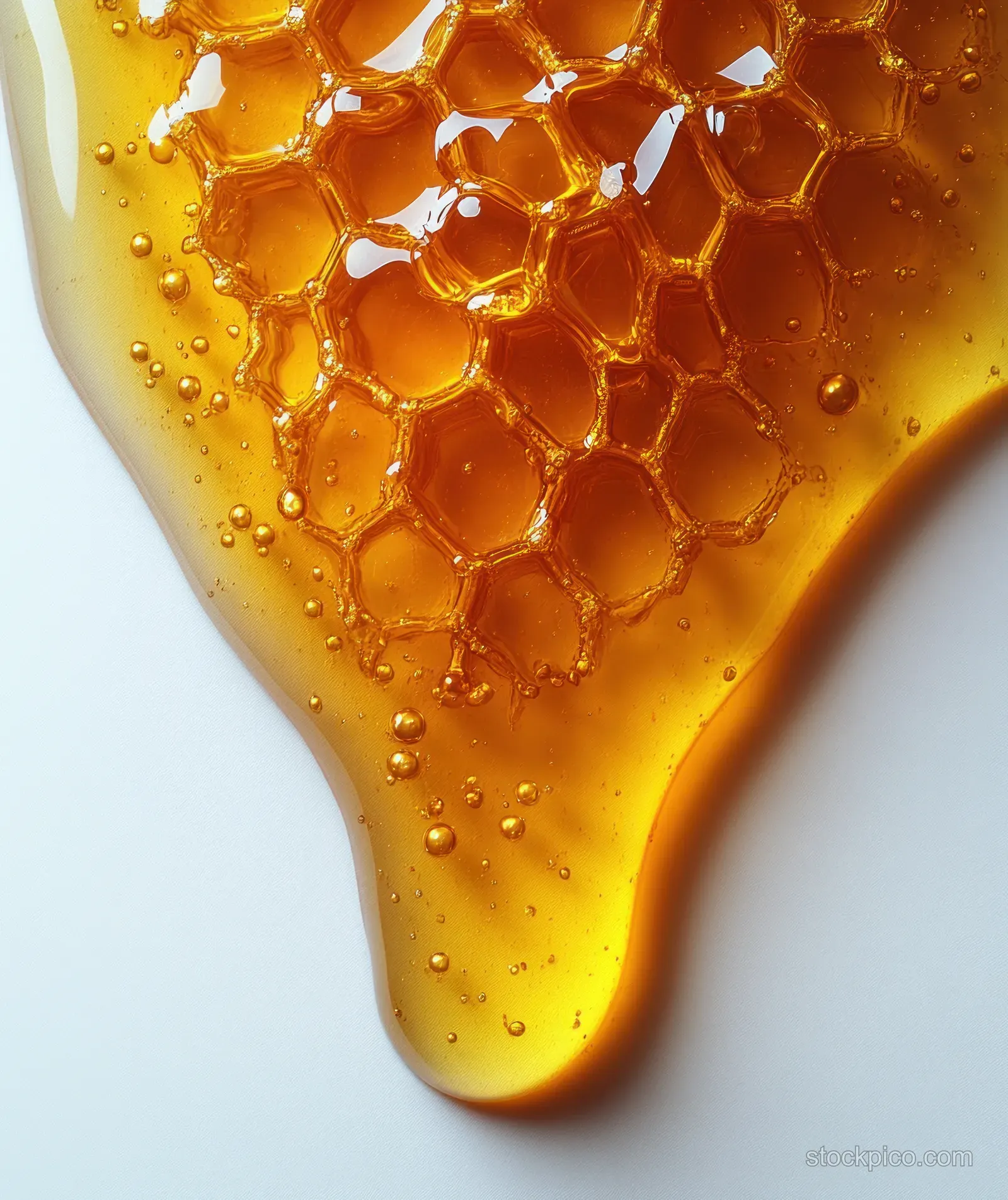 Golden oil drips from a fish oil capsule onto a white background with glossy gel texture.