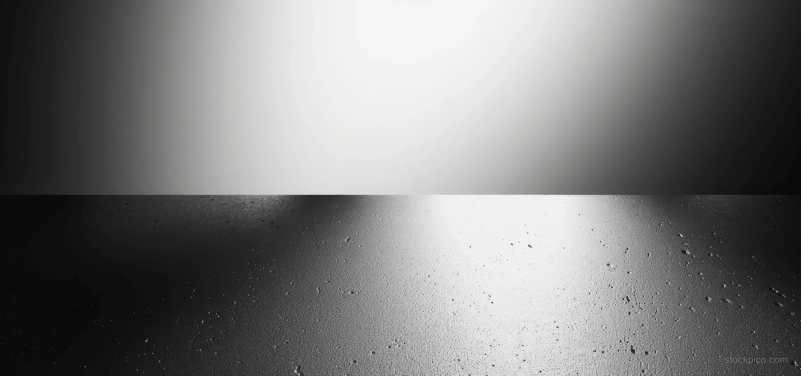 Grey gradient background with grainy texture and soft light.