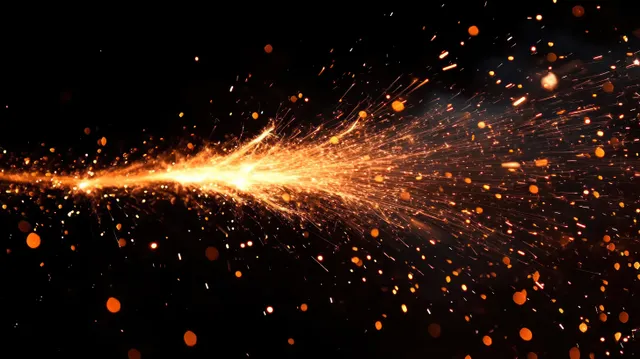 Orange and yellow sparks scatter and streak across a dark background, frozen in fast motion.