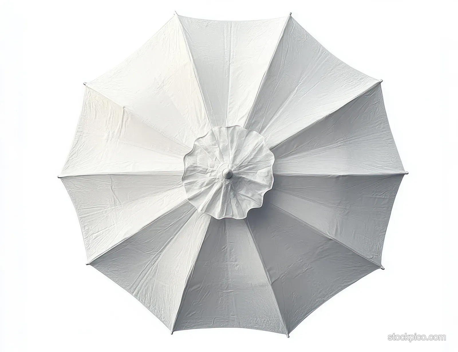 Top view of a wide white outdoor umbrella with fabric folds and soft shadows around the center hub.