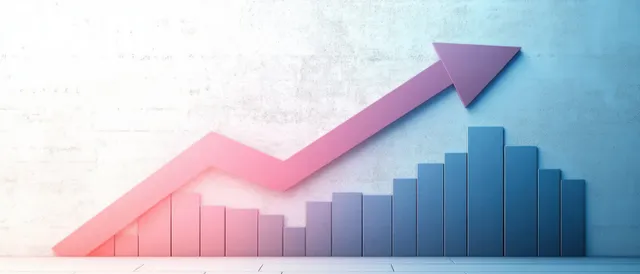3D bar chart with ascending blue bars and a large pink upward arrow indicating growth on a textured wall.