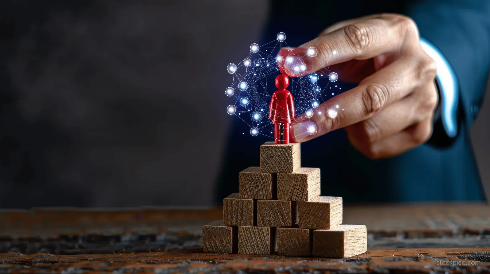 A hand places a red wooden figure on top of stacked wooden stairs blocks with career-focused lighting effects.