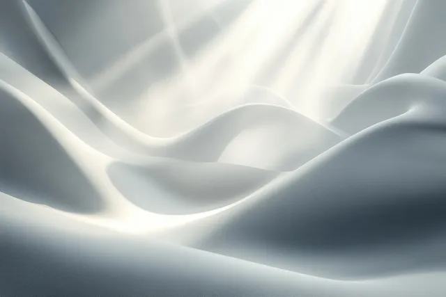 Dappled leaf shadows drift across a smooth white wall under soft sunlight.