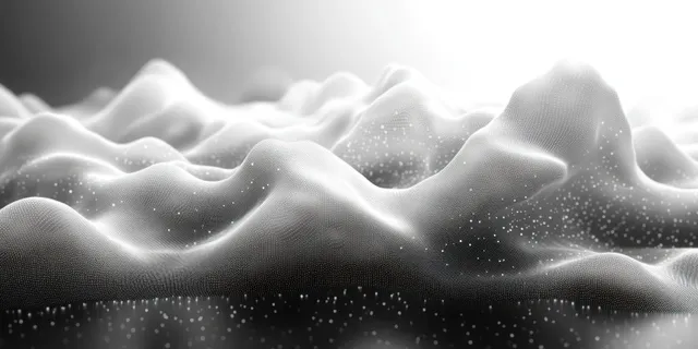 Monochrome wavy surface of tiny dot particles ripples like a glowing wave crest in soft depth.