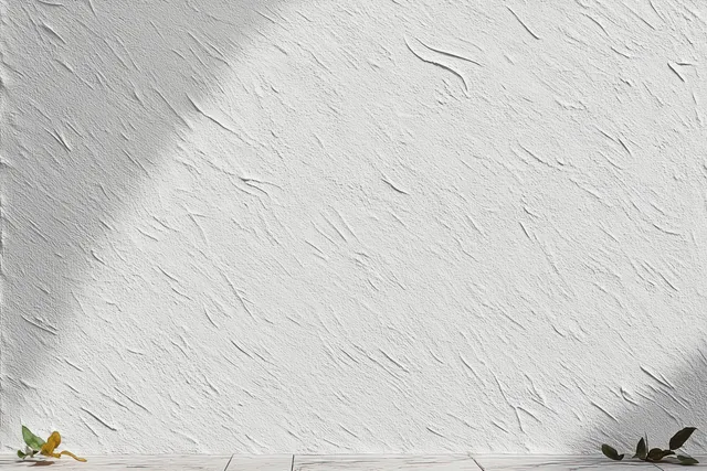 White textured wallpaper wall with subtle uneven plaster and soft shadow variations