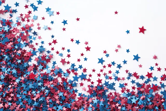 Star-shaped red, white, and blue confetti bursts across a pastel blue background.