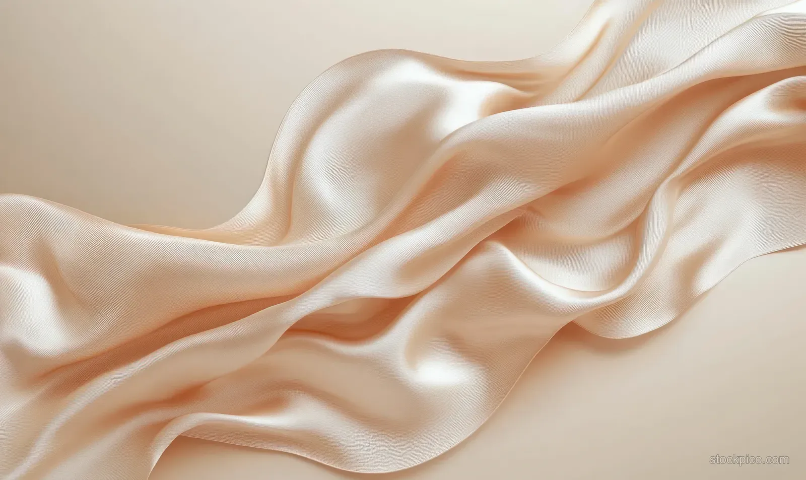 Light beige silk fabric close-up with flowing folds and soft shadows forming a minimal textured background.