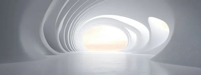 White curved tunnel interior with soft glowing light through an opening at the far end.