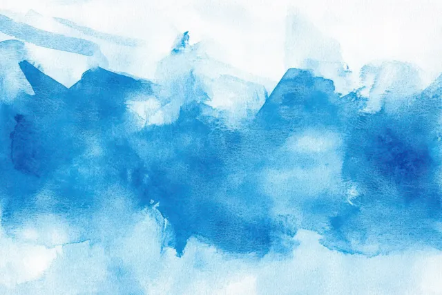 Abstract blue watercolor wash with textured paper grain, layered stains, and soft misty gradient background.