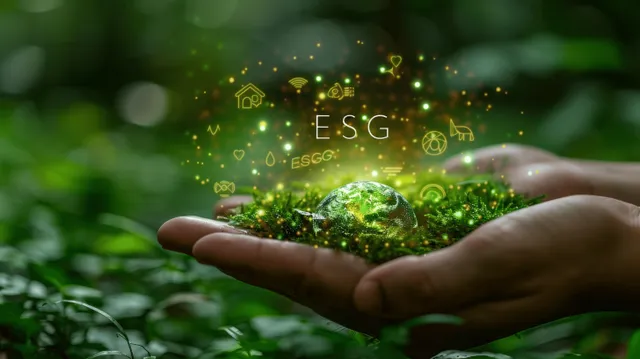 Hands hold a glowing ESG sphere with floating icons and a faint Earth hologram against a green bokeh background.