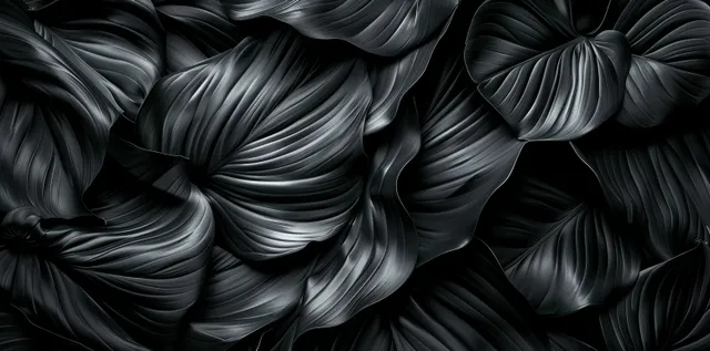 Black satin leaf texture top view with swirling crumpled folds