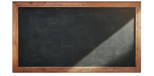 Blank chalkboard with a wooden retro frame under soft diagonal light and empty writing surface.