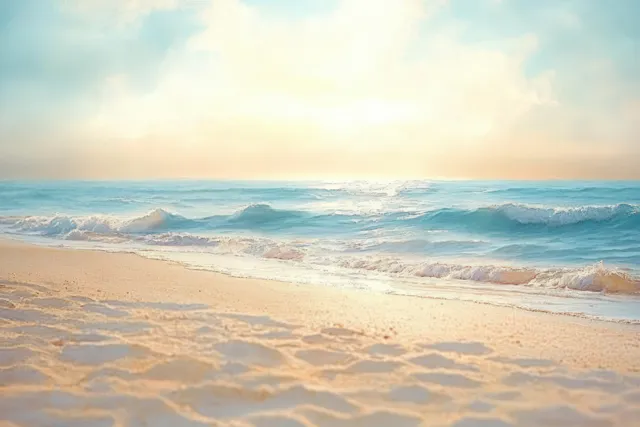 Close-up sandy beach foreground with blurred sea waves and soft summer sky