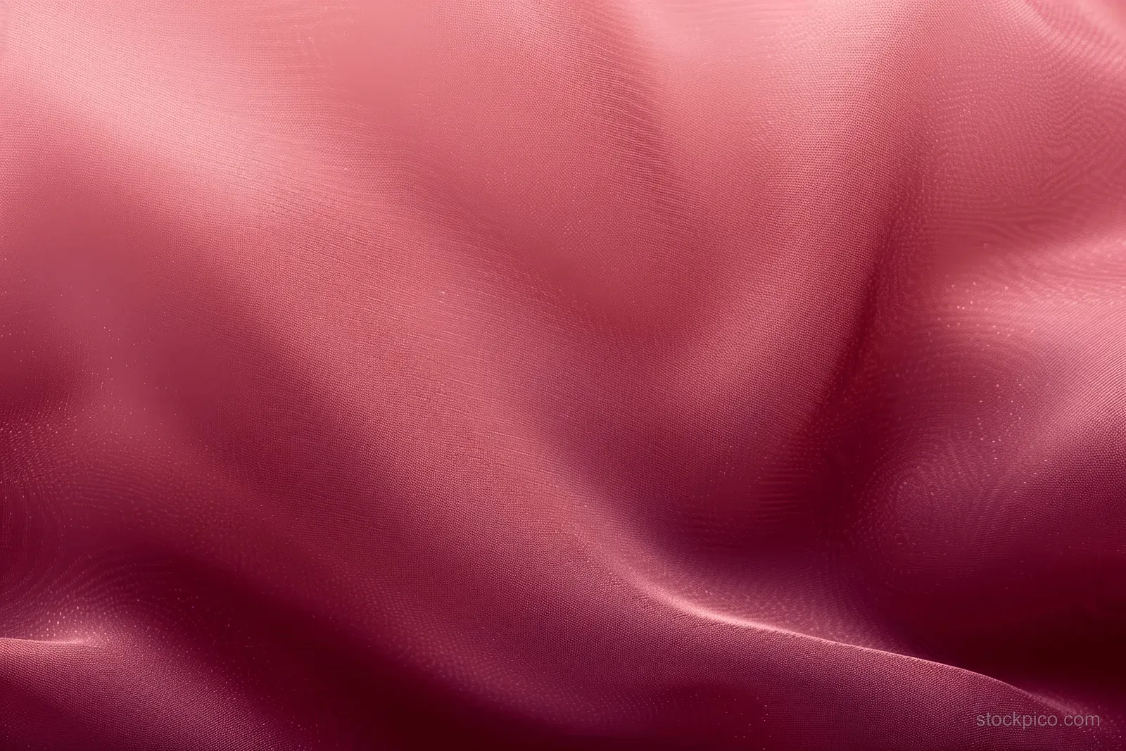 Maroon satin fabric background with pink gradient and gentle folded texture.