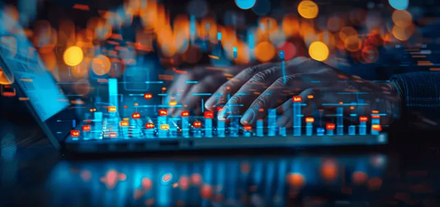 A businessman studies financial dashboards on a laptop and tablet with a glowing growth chart overlay behind him.