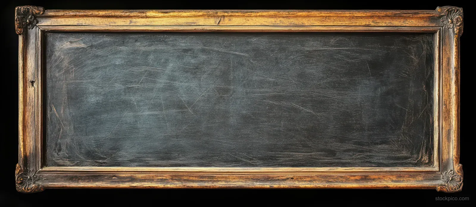 Rectangular chalkboard with an aged wooden frame, scratched black surface, and faint chalk marks.