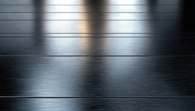 Brushed stainless steel panels with horizontal grain lines and soft reflective highlights.