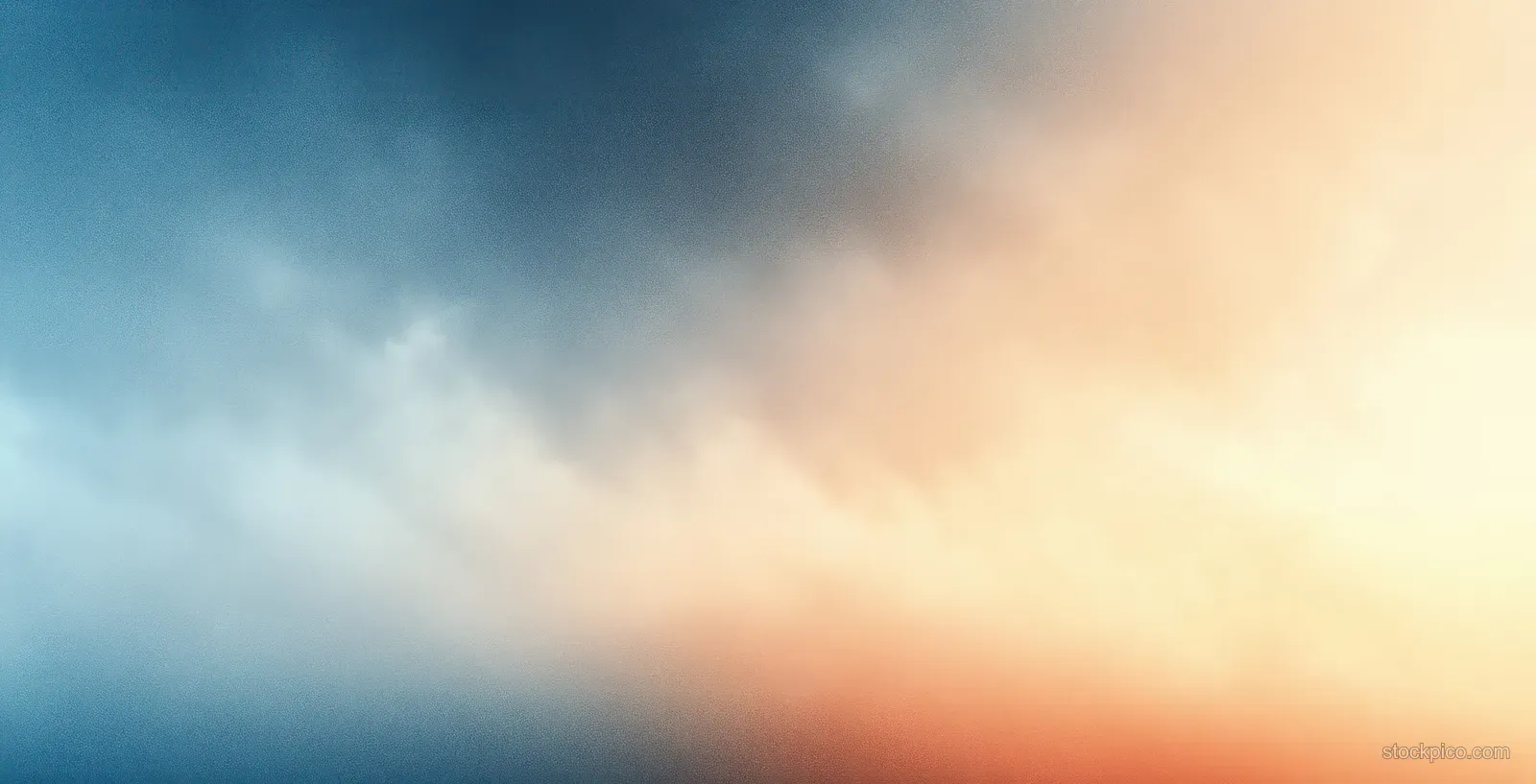 Soft blue and beige abstract gradient with blurred light and haze.