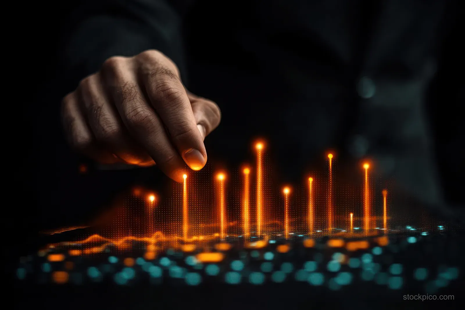 A hand reaches toward glowing orange and blue data bars on a dark digital interface.