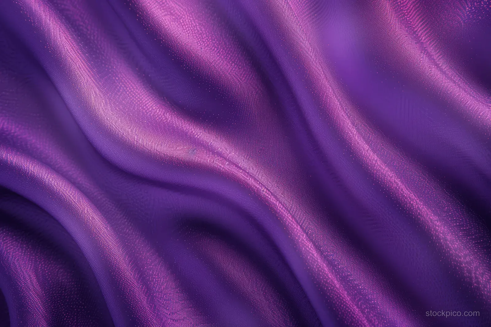 Purple and pink satin velvet fabric background with smooth gradient and visible draped folds.