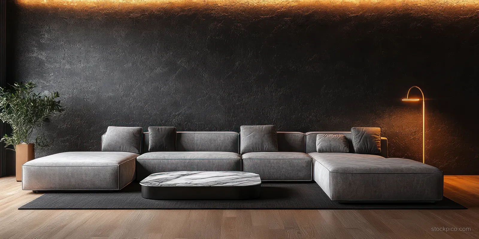 Grey sectional sofa and marble coffee table sit in a dark minimalist living room lit by a warm floor lamp.